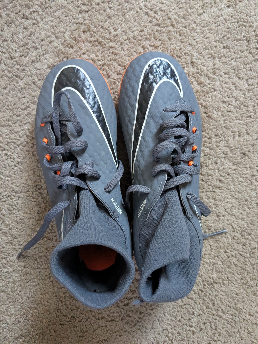 Nike Kids' Gray Soccer Cleats with Orange Accents